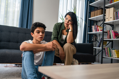 mother and teen son in a serious discussion